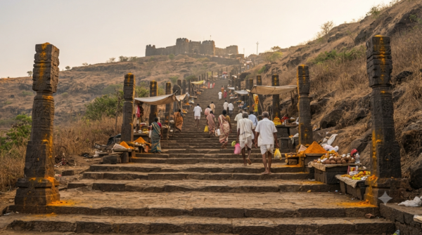 Khandoba Temple Darshan queue on the stone steps of Jejuri Gad in early morning light