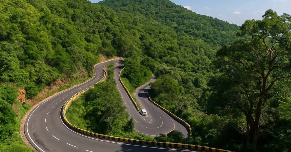 Scenic view of Tirumala Ghat Road with winding hairpin bends surrounded by lush green hills.
